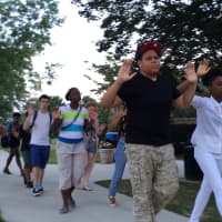 <p>Kena Outlar (front left) and Vanity Robinson (right) lead the silent walk around campus. </p>