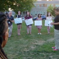 <p>Kena Outlar read a poem at the Manhattan College vigil for Michael Brown. Outlar organized the vigil with the Connie Hogarth Center. </p>