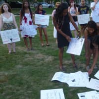<p>Students organize signs prior to Wednesday&#x27;s vigil at Manhattanville College for Ferguson, Mo. shooting victim Michael Brown. </p>