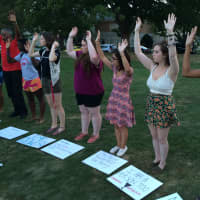 <p>Students put their hands up, like they believe Michael Brown did when confronted by police officer Darren Wilson in Ferguson, Mo.</p>