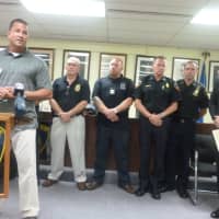 <p>A somber Stamford Mayor David Martin, at right, looks on as Lt Diedrich Hohn talks at a press conference Thursday morning announcing the capture of the suspect in the fatal stabbing of Stamford Taxi driver Mahomed Kamal.</p>