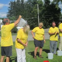 <p>Supervisor Linda Puglisi gets a bucket of ice water dumped over her to raise money for ALS. </p>