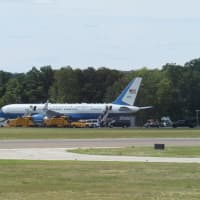 <p>The president&#x27;s traveling partners depart Air Force One.</p>