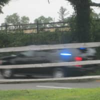 <p>The president&#x27;s motorcade whizzes by on Route 448.</p>