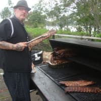 <p>Tim Doherty of Bobby Q&#x27;s smokes meat at the Blues, Views and BBQ Festival in Westport.</p>