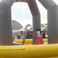 <p>There was an entire row of inflatable fun games such as the Wrecking Ball at the Blues, Views and BBQ Festival.</p>
