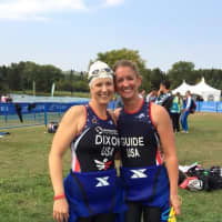 <p>Amy Dixon of Greenwich, left, with her guide Lindsey Cook, finished eighth at the ITU World Triathlon Championships Saturday in Edmonton, Canada.</p>