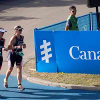 <p>Amy Dixon, right, a blind triathlete, runs with guide Lindsey Cook in the World Triathlon Championships.</p>
