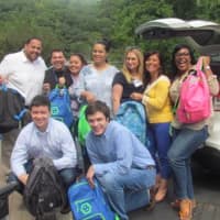 <p>Members of the ANDRUS drive pack more than 750 backpacks for children in need. </p>