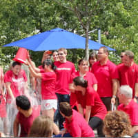 <p>HomeServe of Norwalk goes down the row for the Ice Bucket Challenge for ALS.</p>