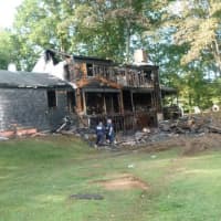 <p>A home at 25 Bittersweet Lane in North Stamford was destroyed by an early morning fire Wednesday. The three occupants escaped. The cause is under investigation.</p>