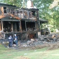 <p>A home at 25 Bittersweet Lane in North Stamford was destroyed by an early morning fire Wednesday. The three occupants escaped. The cause is under investigation.</p>
