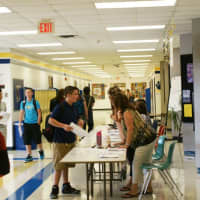 <p>A student at Walter Panas HS asks a question to a faculty member.</p>