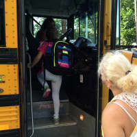 <p>Students board the school bus Wednesday. </p>
