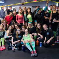 <p>CrossFit Immortal members relax after an intense competition earlier this year.</p>