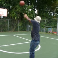 <p>Allan Roberson, 19, shoots hoops on his school&#x27;s new basketball court. </p>