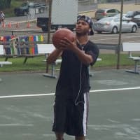 <p>Carlos Pena takes a shot on his old school&#x27;s new basketball court. </p>