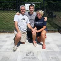 <p>Pelter with his parents, Sam and Susan.</p>