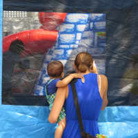 <p>There were bounce castles and other games for children in New Rochelle.</p>