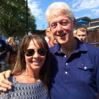 <p>School of Education Assistant Clinical Professor Lauren Birney with former President Clinton.</p>