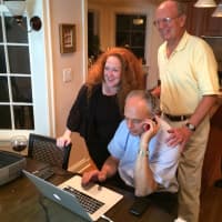 <p>Leon Potok (center) calls in early returns in the Democratic Primary for the Village of Mamaroneck Tuesday night. </p>