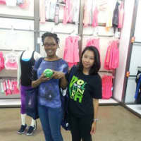<p>An Old Navy volunteer poses with a teen from the Boys &amp; Girls Club Mount Vernon during the group&#x27;s field trip to the store. </p>