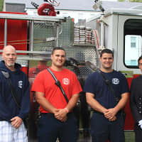 <p>Firefighters attend the ceremony to remember victims of Sept. 11 on Thursday at Wooster School in Danbury.</p>