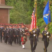 <p>Wilton firefighters and police officers march in the tribute held Thursday morning in honor of those who died in the Sept. 11 attacks.</p>