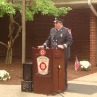<p>Former Wilton Firefighter Jason Mumbach pays respects to the victims of Sept. 11.</p>