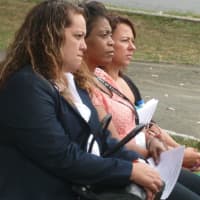 <p>Attendees listen to speeches during the 9/11 Memorial ceremony at Jackie Robinson Park in Stamford.</p>