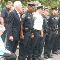 <p>Attendees pause to remember during the 9/11 memorial ceremony in New Canaan.</p>