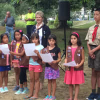 <p>Larchmont-Mamaroneck Girl Scouts lead the audience in singing &quot;God Bless America.&quot;</p>