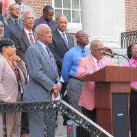 <p>Mount Vernon City Clerk George Brown sings the national anthem during a 9/11 ceremony in 2014.</p>