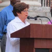 <p>City Council President Roberta Apuzzo speaks to the crowd.</p>