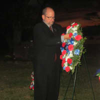 <p>Ossining Mayor Bill Hanauer lays a wreath at a Sept. 11 ceremony in Ossining.</p>