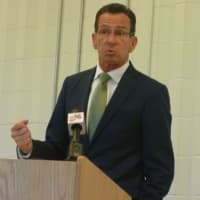 <p>Gov. Dannel P. Malloy speaks at the official opening of the Norwalk Early College Academy at Norwalk High School on Friday. NECA allows students to earn a high school diploma and a two-year degree from Norwalk Community College.</p>