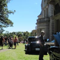 <p>Visitors enjoy the Antique and Classic Car Show at the Lockwood-Mathews Mansion Museum&#x27;s 2013 Old-fashioned Flea Market.</p>