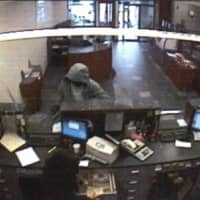 <p>Surveillance footage of the bank robbery suspect at the counter of the Hudson United Bank on Westport Avenue in Norwalk.</p>
