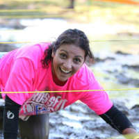 <p>Runners crawled through mud and other obstacles during the fourth annual Evan Lieberman Westchester Medical Center Trauma Mud Run on Sunday. </p>