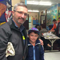 <p>Bill Brady brings his son, Joseph, 10, to Mamaroneck Avenue School in White Plains on Tuesday. </p>