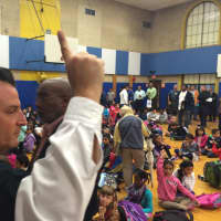 <p>Mamaroneck Avenue School Assistant Principal Robert Janowitz silences the crowd of students with a single finger. </p>