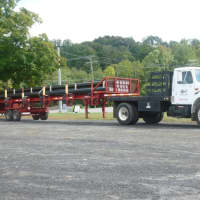 <p>A truck with a load of pipe for the Yankee Gas natural gas pipeline project waits to be unloaded Monday.</p>