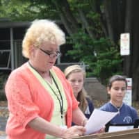 <p>Our Lady of Fatima School Principal Martha Reitman speaks at a 9/11 Memorial Service.</p>