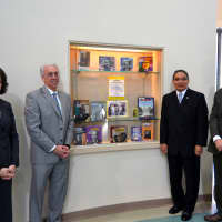 <p>John Marshall poses with C.E.S. leaders in front of a display case dedicated to his father, Thurgood Marshall, at the Thurgood Marshall Middle School at Six to Six Interdistrict Magnet School in Bridgeport. See story for names.</p>