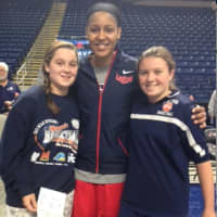 <p>Kaitlin Reif and Bridgette Wall pose with Maya Moore, a UCONN women&#x27;s basketball player.</p>