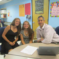 <p>Kaitlyn Comerford, Sara Mongno at the writing center with English teacher Leo Sposato. </p>