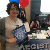 <p>Tania Saiz helps HeadCount and the White Plains League of Women Voters register people to vote Tuesday. </p>