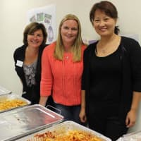 <p>PTA members serve pasta at the Pocantico Hills welcome back pasta night on Friday, Sept. 19.</p>
