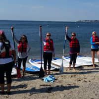 <p>Some of the Royle Moms pose with their paddles during their recent Go to Town outing.</p>