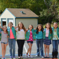 <p>A group of North Salem Girl Scouts poses for photos at the new mural at Pequenakonck Elementary School.</p>